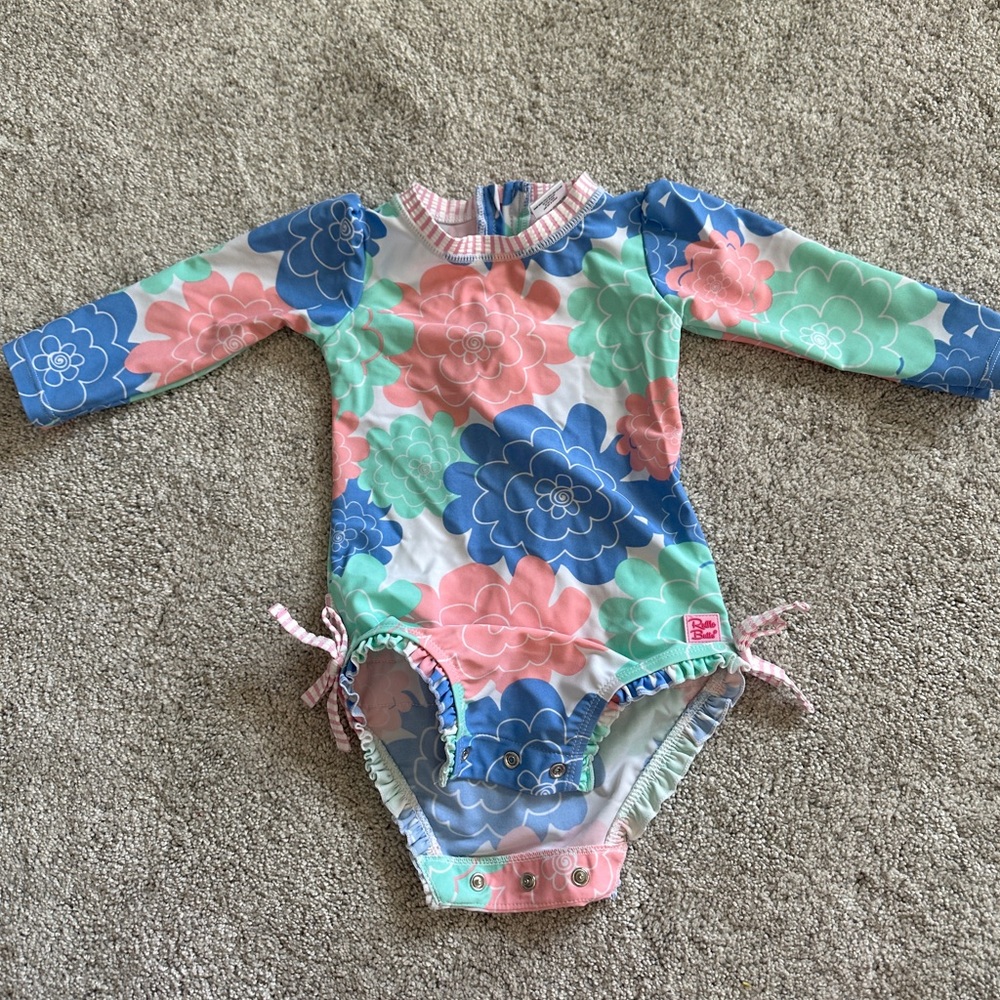 Floral 12-18 months long sleeve Ruffle Butts swimsuit.